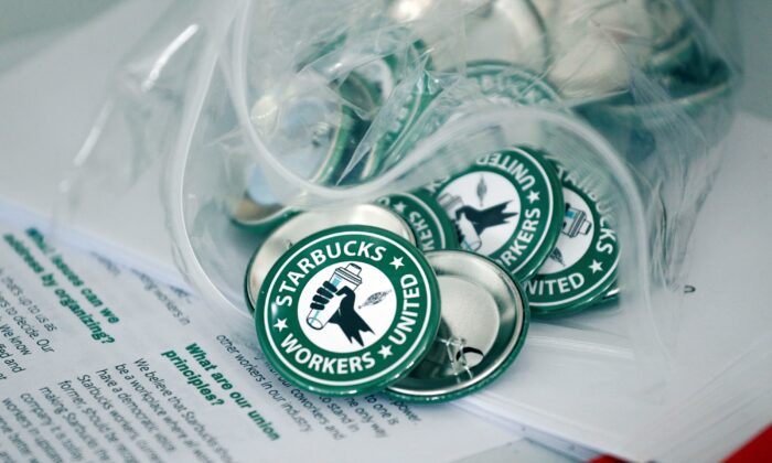 Pro-union pins sit on a table during a watch party for Starbucks' employee union election in Buffalo, N.Y., on Dec. 9, 2021. (Joshua Bessex/AP Photo)