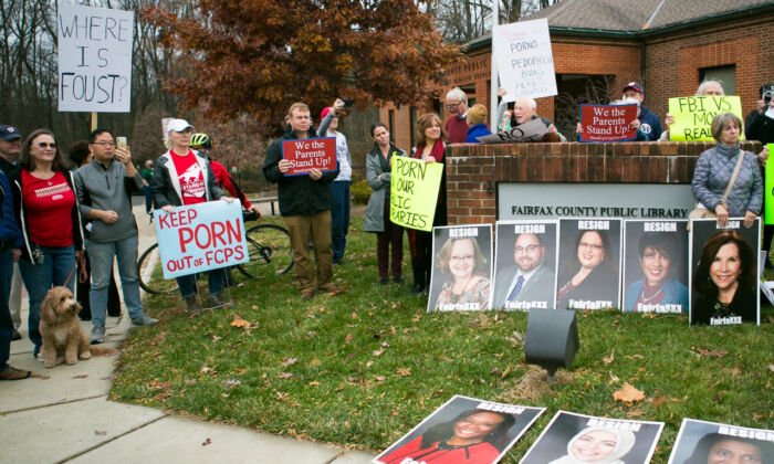 Parents and residents protest against a display featuring the Bible next to "Gender Queer" and "Lawn Boy"—the two challenged books returned to Fairfax County school libraries after the Thanksgiving holiday—outside Dolley Madison Public Library in McLean, Va., on Dec. 11, 2021. (Lisa Fan/The Epoch Times)