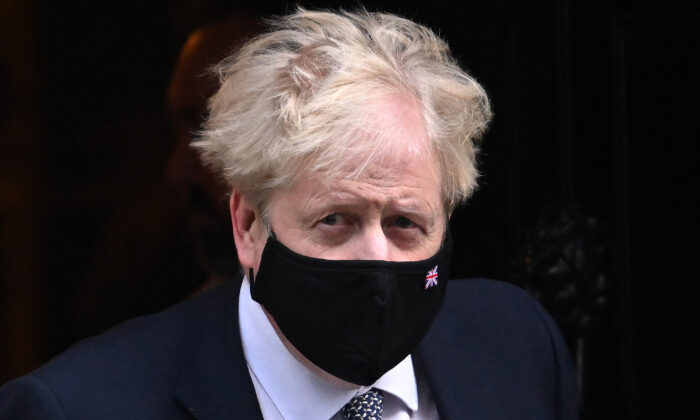 Prime Minister Boris Johnson leaves 10 Downing Street for Prime Minister’s Questions in the House of Commons, on Jan. 12, 2022. (Leon Neal/Getty Images)