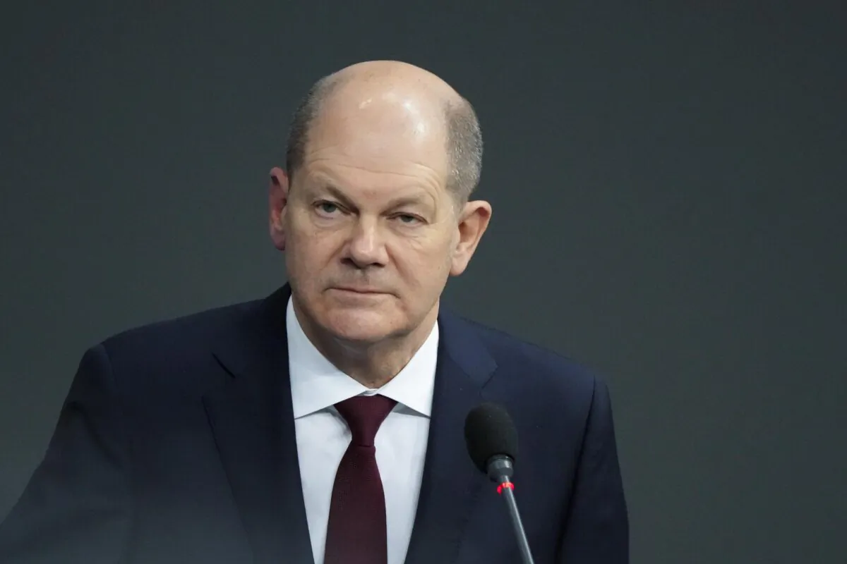 German Chancellor Olaf Scholz answers questions about mandatory vaccination from a lawmaker of the Alternative for Germany, AFD, party during a session of the Parliament Bundestag in Berlin, Germany, on Jan. 12, 2022. (Markus Schreiber/AP Photo)