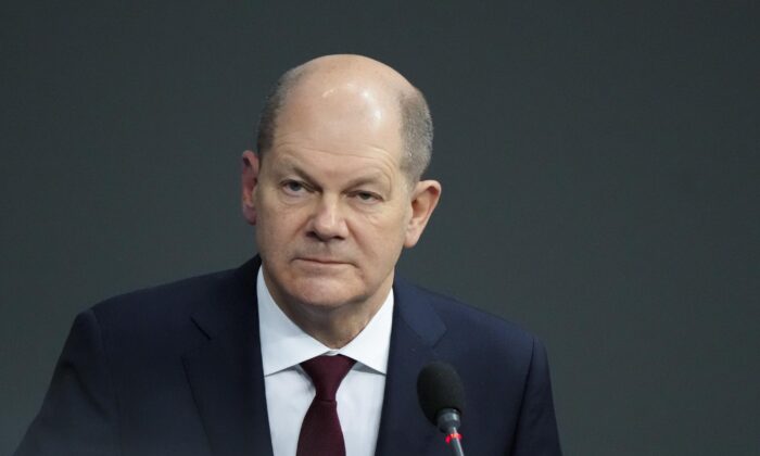 German Chancellor Olaf Scholz answers questions about mandatory vaccination from a lawmaker of the Alternative for Germany, AFD, party during a session of the Parliament Bundestag in Berlin, Germany, on Jan. 12, 2022. (Markus Schreiber/AP Photo)
