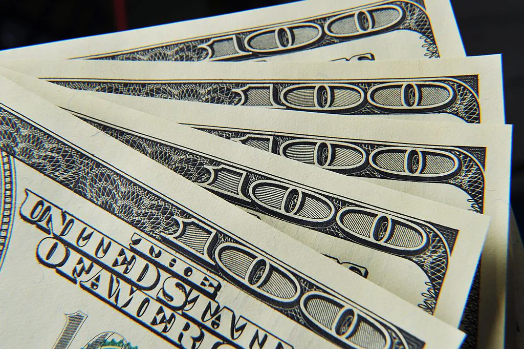 A close-up of several United States 100-dollar bills in Washington on Dec. 7, 2010. (Paul J. Richards/Getty Images)