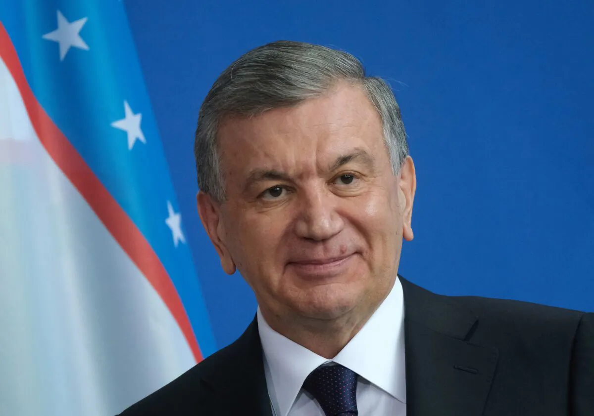 Uzbek President Shavkat Mirziyoyev and German Chancellor speaks to the media in Berlin on Jan. 21, 2019. (Sean Gallup/Getty Images)