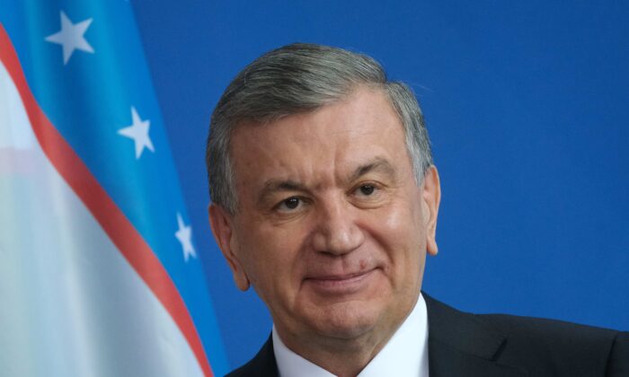 Uzbek President Shavkat Mirziyoyev and German Chancellor speaks to the media in Berlin on Jan. 21, 2019. (Sean Gallup/Getty Images)