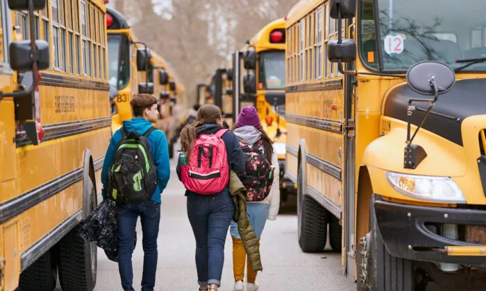 Students head to school buses after school, in this file photo. (Geoff Robins/AFP via Getty Images)