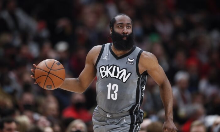 Brooklyn Nets guard James Harden (13) dribbles the ball up court against the Chicago Bulls during the second half at United Center in Chicago, on Jan. 12, 2022. (Kamil Krzaczynski-USA TODAY Sports via Field Level Media)
