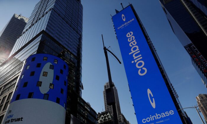 The logo for Coinbase Global Inc., the biggest U.S. cryptocurrency exchange, is displayed on the Nasdaq MarketSite jumbotron and others at Times Square in New York, on April 14, 2021. (Shannon Stapleton/Reuters)