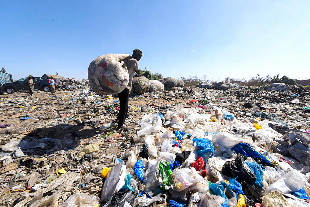 Plastic trash is dumped at the Mbeubeuss landfill on January 5, 2016 in Dakar, Senegal, where a new law prohibits the use of certain plastic bags. The implementation of the measure was launched on January 4, 2016 in Dakar in a campaign for a period of one week in an effort to clean up cities and raise awareness of the need to rid the environment of these pollutants. AFP PHOTO / SEYLLOU / AFP / SEYLLOU (Photo credit should read SEYLLOU/AFP/Getty Images)