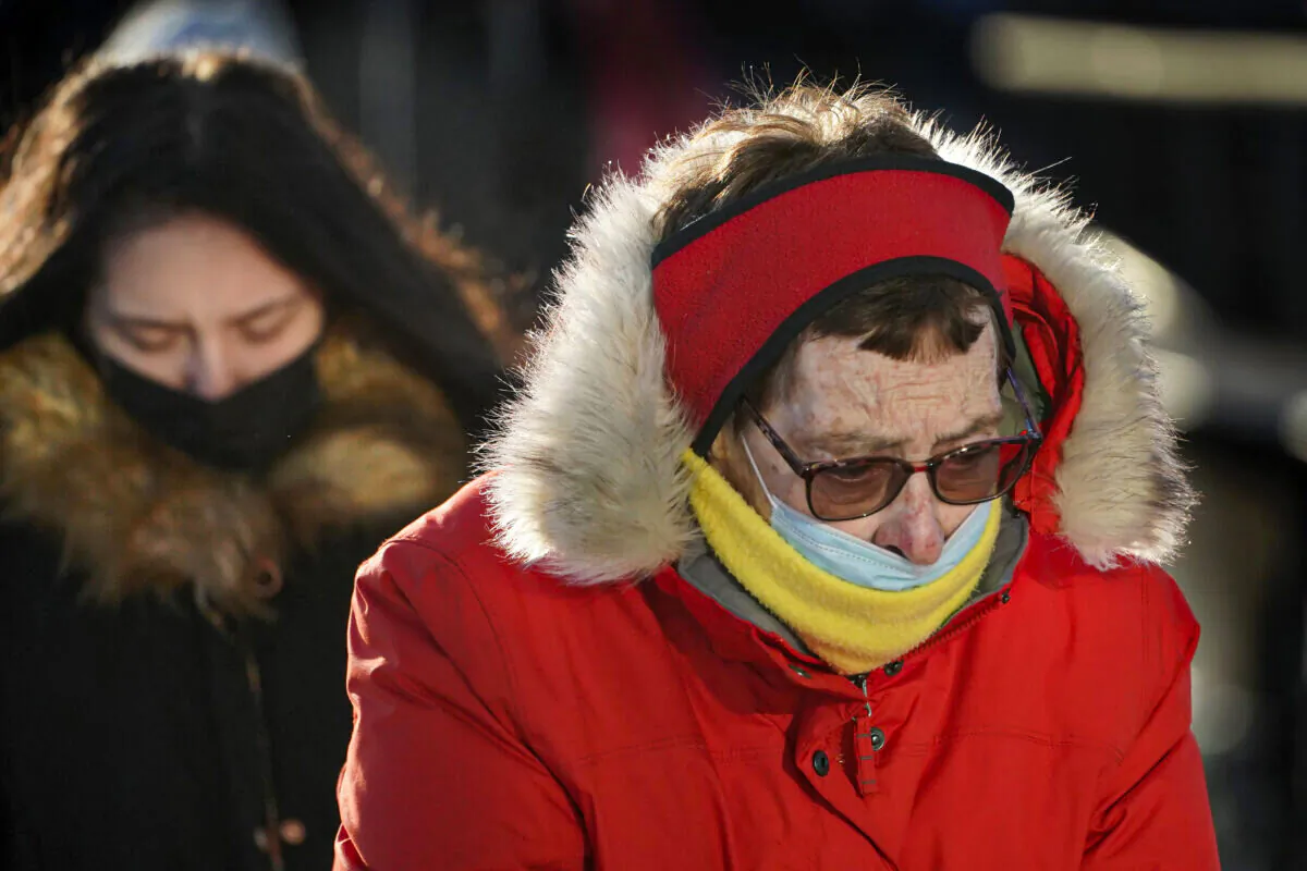 Commuters brave frigid temperatures as they arrive on a ferry in Portland, Maine on Jan. 11, 2022. (Robert F. Bukaty/AP Photo)