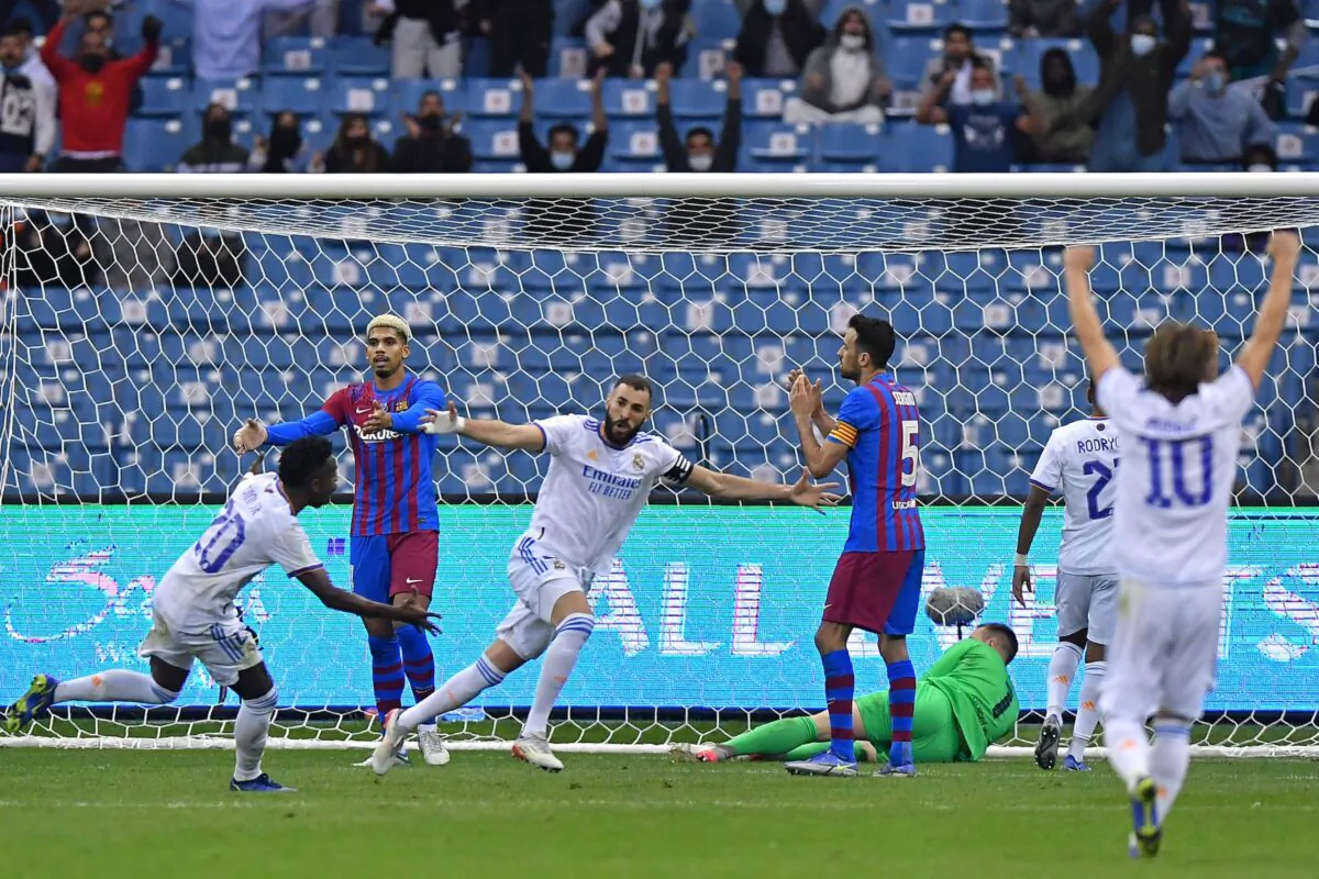 Real Madrid's French forward Karim Benzema (C) reacts after scoring during the Spanish Super Cup semi-final football match between Barcelona and Real Madrid at the King Fahad International stadium in the capital, Riyadh, Saudi Arabia, on January 12, 2022. (AFP via Getty Images)