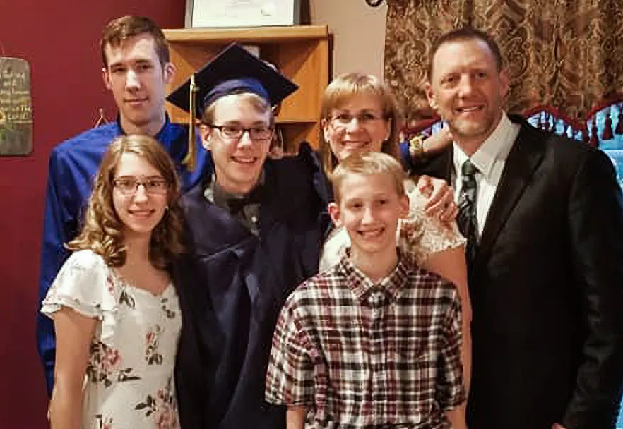 JR Hoell (R) with his wife and children in an undated photo. (Courtesy JR Hoell)