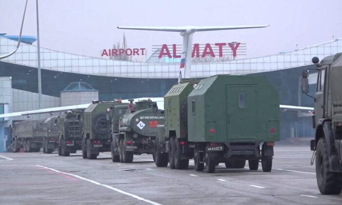 Russian military vehicles drives upon arrival at Almaty airport, as part of a peacekeeping mission of the Collective Security Treaty Organisation, in Almaty, Kazakhstan, in this still image from video released by Russia's Defence Ministry, on Jan. 9, 2022. (Russian Defence Ministry/ via Reuters)