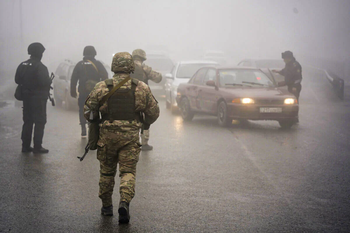 Kazakhstan's soldiers control the road in Almaty, Kazakhstan, on Jan. 8, 2022. (Vladimir Tretyakov/NUR.KZ via AP)