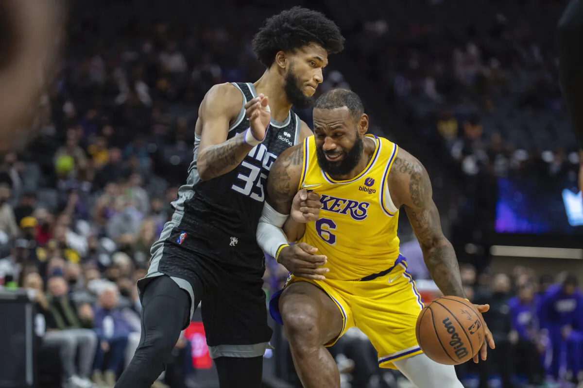 Sacramento Kings forward Marvin Bagley III (35) defends Los Angeles Lakers forward LeBron James (6) in the first quarter of an NBA basketball game in Sacramento, Calif., on Jan. 12, 2022. (AP Photo/José Luis Villegas)