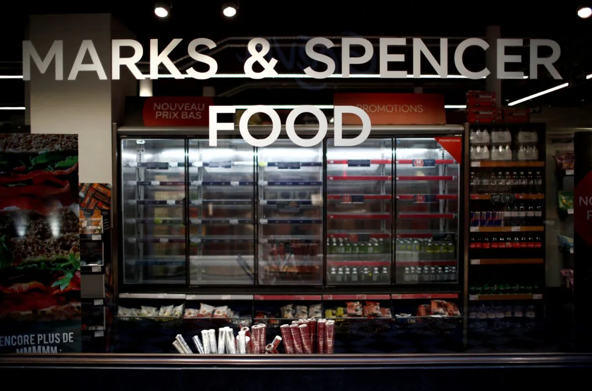Empty shelves are seen behind a M&S logo at a Marks & Spencer food store in Paris, on Jan. 5, 2021. (Gonzalo Fuentes/Reuters)