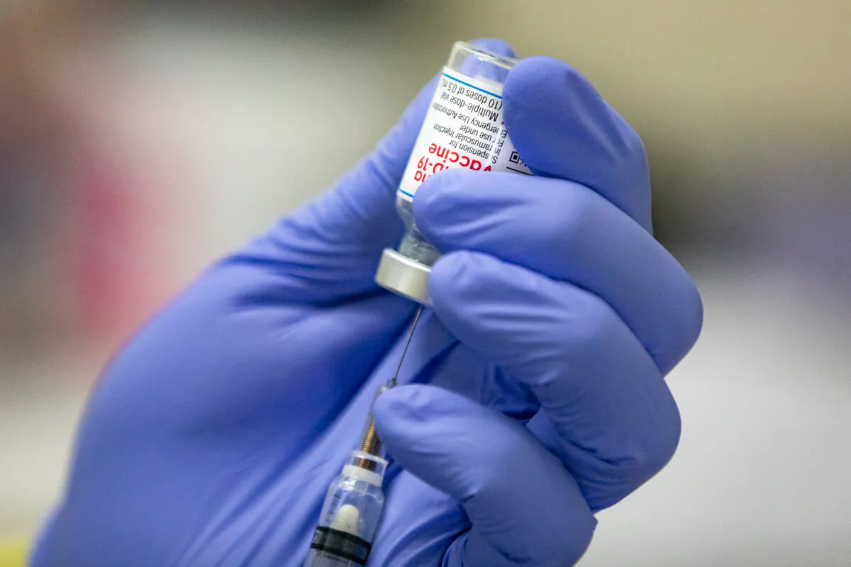 The COVID-19 Moderna Vaccination prepared at Lestonnac Free Clinic in Orange, Calif., on March 9, 2021. (John Fredricks/The Epoch Times)