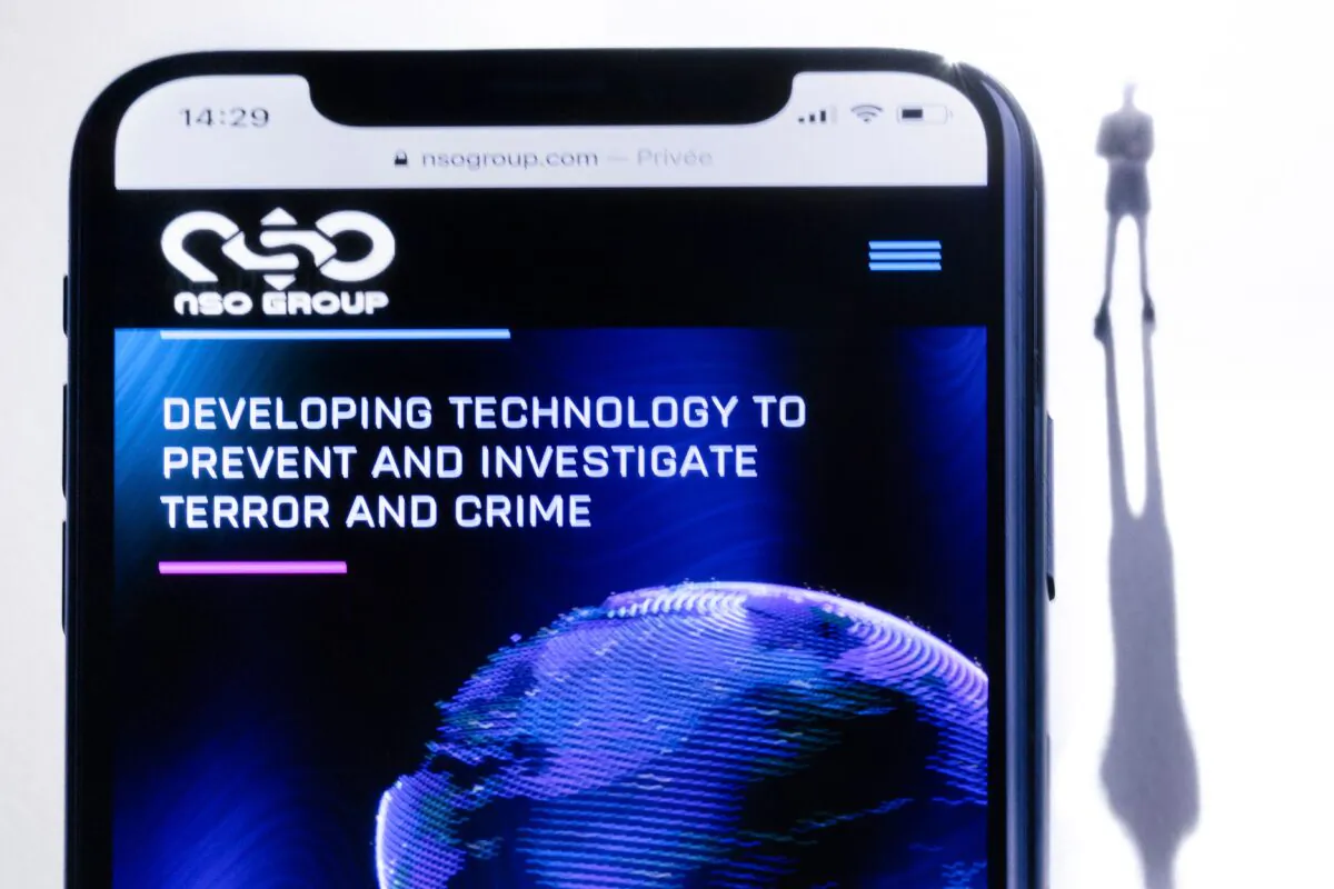 A smartphone with the website of Israel's NSO Group, which features 'Pegasus' spyware, is displayed in Paris on July 21, 2021. (Joel Saget/AFP via Getty Images)