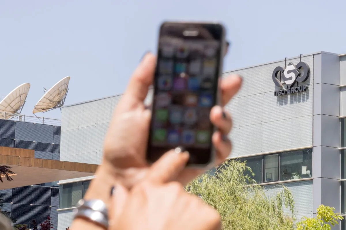 A woman uses her iPhone in a file photo. (Jack Guez/AFP via Getty Images)