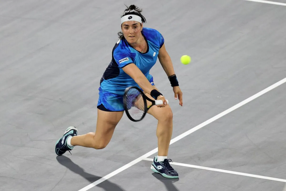 Tunisia's Ons Jabeur in action during her match against Switzerland's Belinda Bencic, at the International Tennis Centre in Zayed Sports City, Abu Dhabi, United Arab Emirates, on Dec. 16, 2021. (Christopher Pike/Reuters)