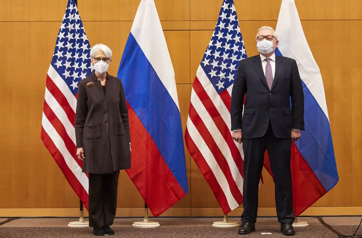 U.S. Deputy Secretary of State Wendy Sherman (L) and Russian Deputy Foreign Minister Sergei Ryabkov (R) pose for pictures as they attend security talks on soaring tensions over Ukraine in Geneva, Switzerland, on Jan. 10, 2022. (Denis Balibouse/Pool/AFP via Getty Images)
