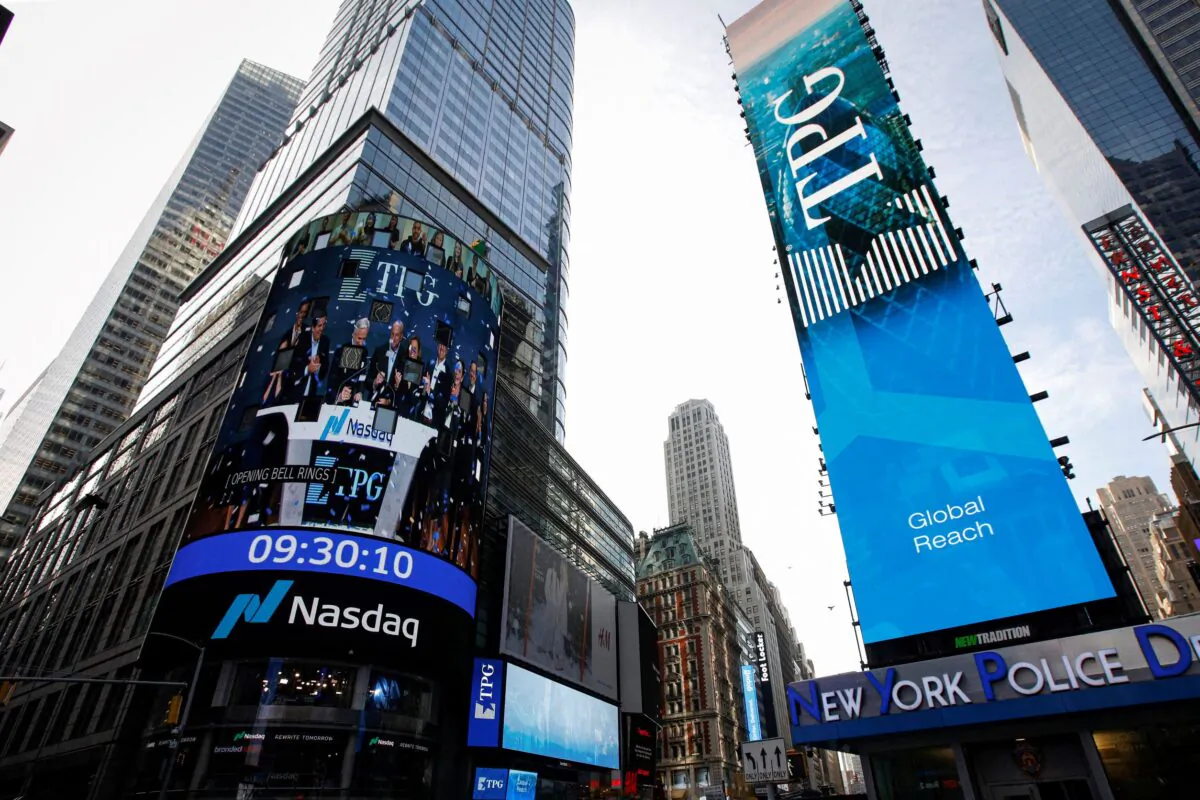 A screen announces the listing of private-equity firm TPG, during the IPO at the Nasdaq Market site in Times Square in New York City, U.S on Jan.13, 2022. (Brendan McDermid/Reuters)