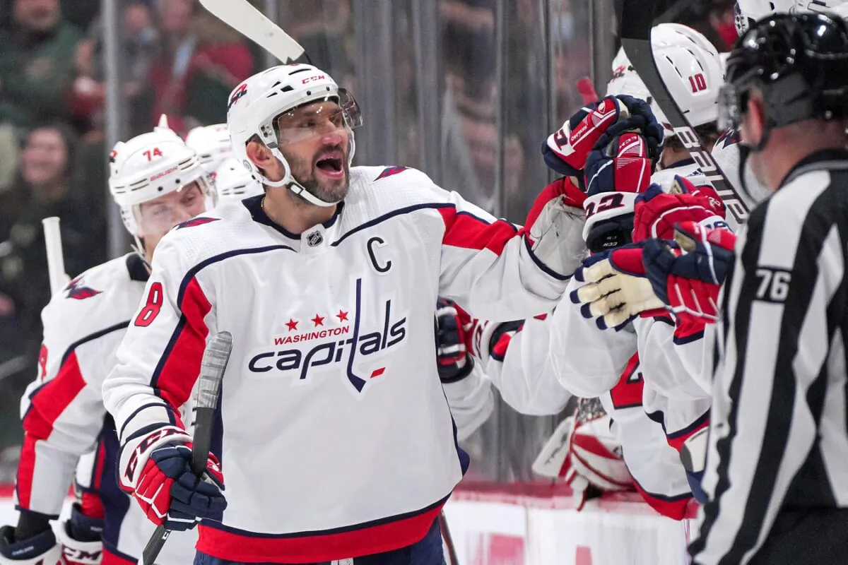 Washington Capitals left wing Alex Ovechkin (8) celebrates, after a goal by center Evgeny Kuznetsov (92) against the Minnesota Wild in the second period at Xcel Energy Center, in Saint Paul, Minn., on Jan. 8, 2022. (Brad Rempel/USA TODAY Sports via Field Level Media)