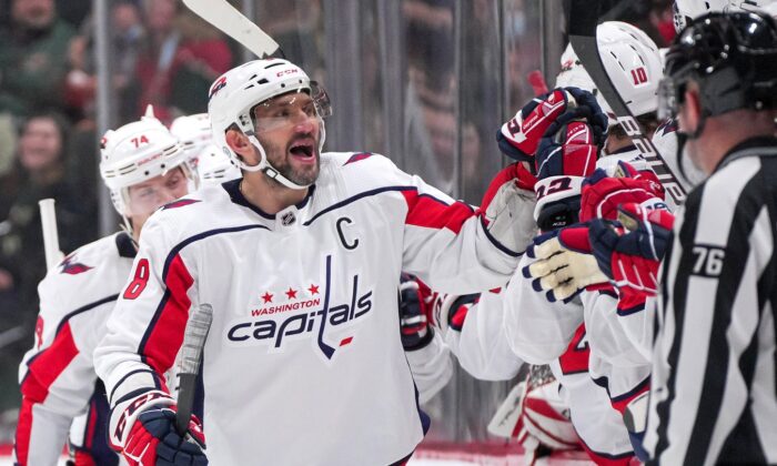 Washington Capitals left wing Alex Ovechkin (8) celebrates, after a goal by center Evgeny Kuznetsov (92) against the Minnesota Wild in the second period at Xcel Energy Center, in Saint Paul, Minn., on Jan. 8, 2022. (Brad Rempel/USA TODAY Sports via Field Level Media)