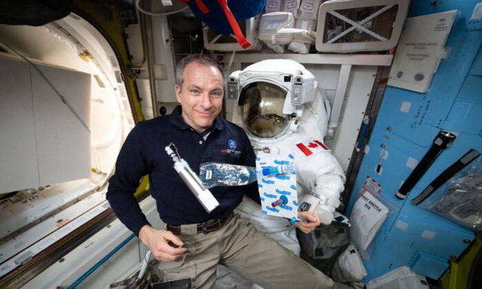 David Saint-Jacques collects breath, ambient air, and blood samples aboard the International Space Station in an undated photo obtained by Reuters on Jan. 14, 2022. (NASA Anne McClain/Handout via Reuters)