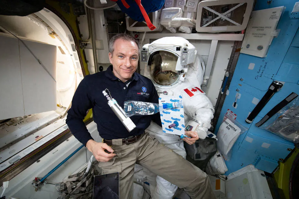 David Saint-Jacques collects breath, ambient air, and blood samples aboard the International Space Station in an undated photo obtained by Reuters on Jan. 14, 2022. (NASA Anne McClain/Handout via Reuters)