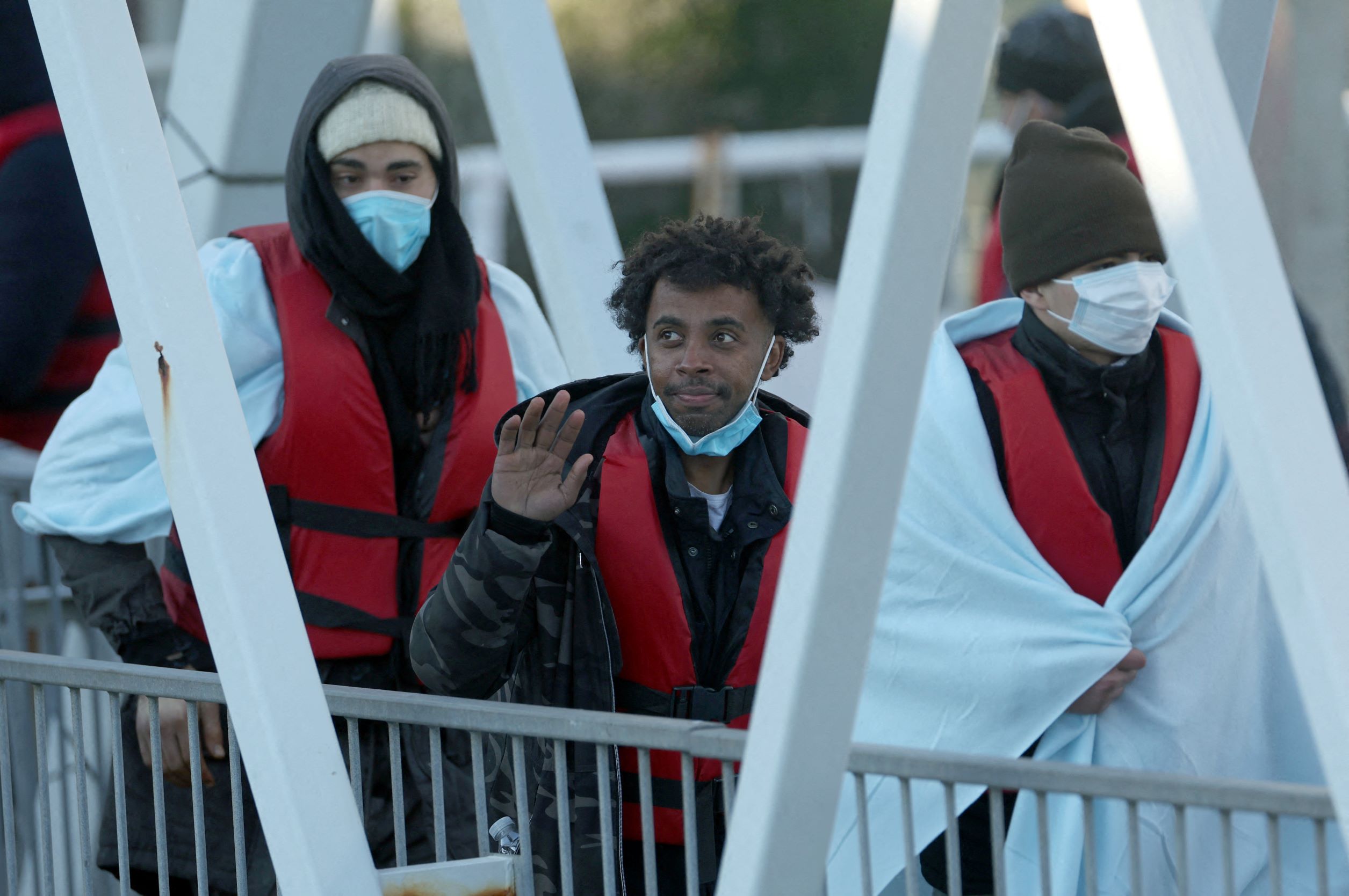 Migrants are escorted into the Port of Dover