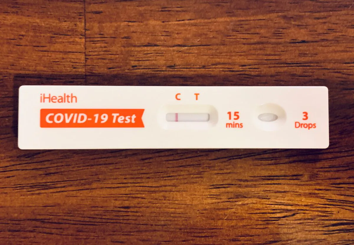 A Negative result is shown from a take-home Covid-19 test kit in Los Angeles on Jan. 10, 2022. (Frederic J. Brown/AFP via Getty Images)
