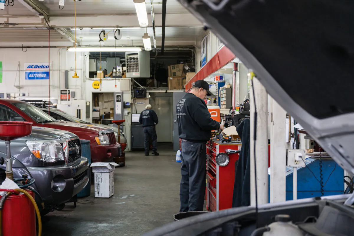 An auto mechanic stands at a workbench at an automotive service in Louisville, Kentucky on Jan. 13, 2022. (Jon Cherry/Getty Images)