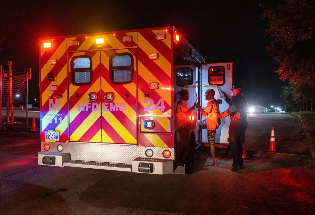 Fire Department paramedics prepare to transport a man to a hospital in a file image. (John Moore/Getty Images)