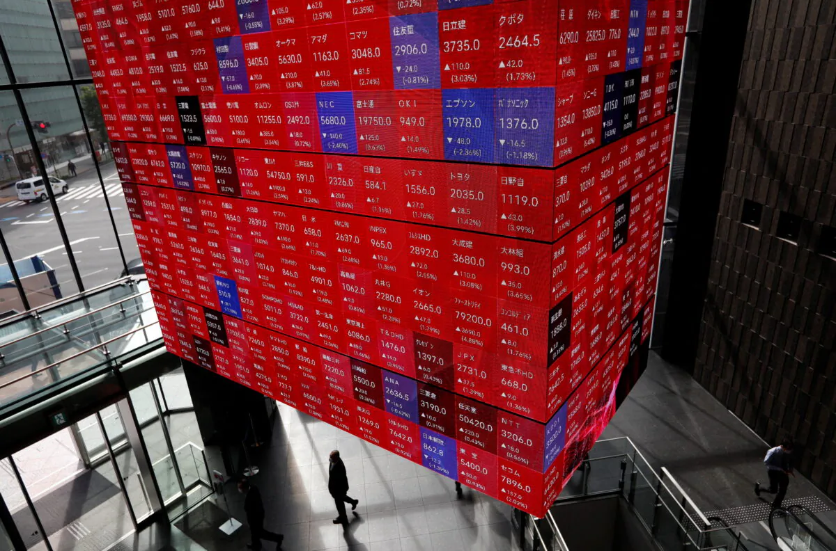An electronic stock quotation board is displayed inside a conference hall in Tokyo on Nov. 1, 2021. (Issei Kato/Reuters)