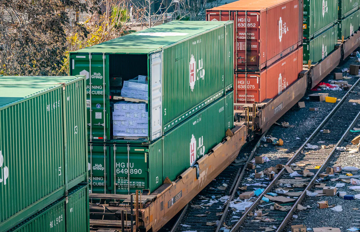 Empty boxes lay scattered near the roadroad tracks after ongoing train robberies in the Lincoln Heights neighborhood of Los Angeles on Jan. 14, 2022. (John Fredricks/The Epoch Times)