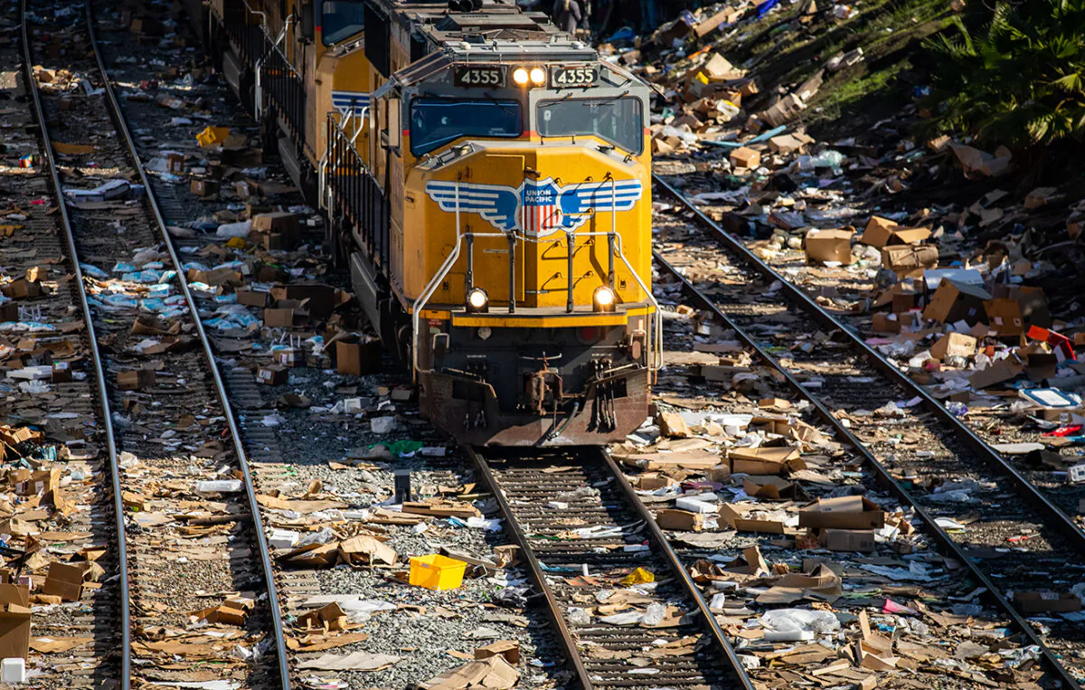 Empty boxes lie scattered near the railroad tracks after ongoing train robberies in the Lincoln Heights neighborhood of Los Angeles on Jan. 14, 2022. (John Fredricks/The Epoch Times)