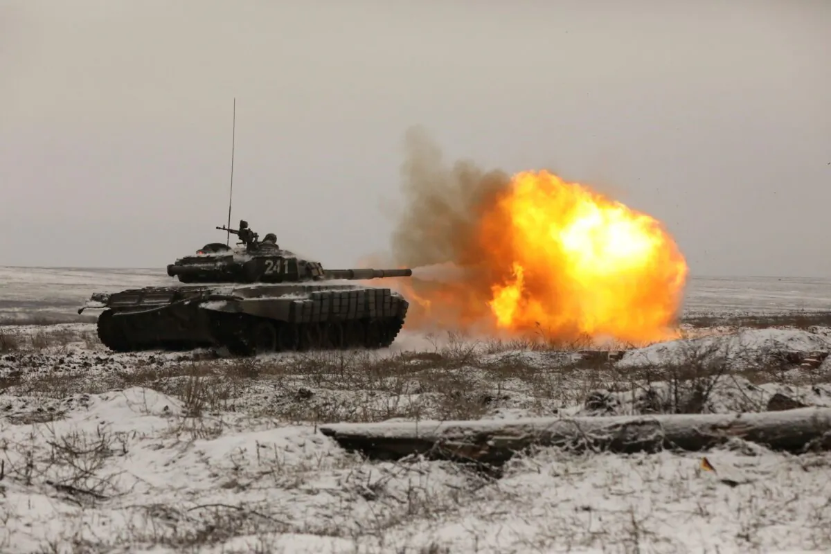 A Russian tank T-72B3 fires as troops take part in drills at the Kadamovskiy firing range in the Rostov region in southern Russia, on Jan. 12, 2022. (AP Photo)