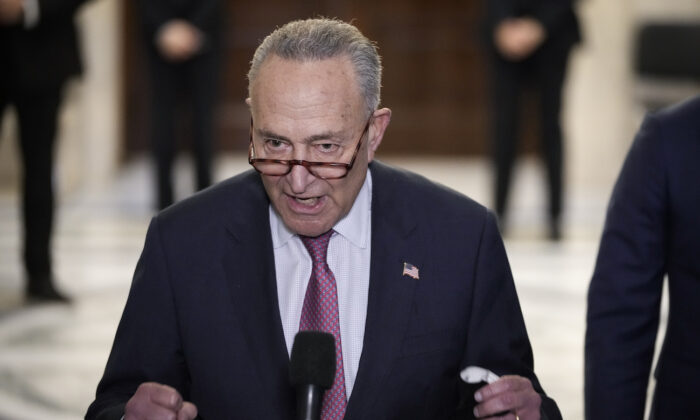 Senate Majority Leader Chuck Schumer (D-NY) speaks to reporters after a meeting with U.S. President Joe Biden and Senate Democrats in the Russell Senate Office Building on Capitol Hill in Washington, on Jan. 13, 2022. (Drew Angerer/Getty Images)