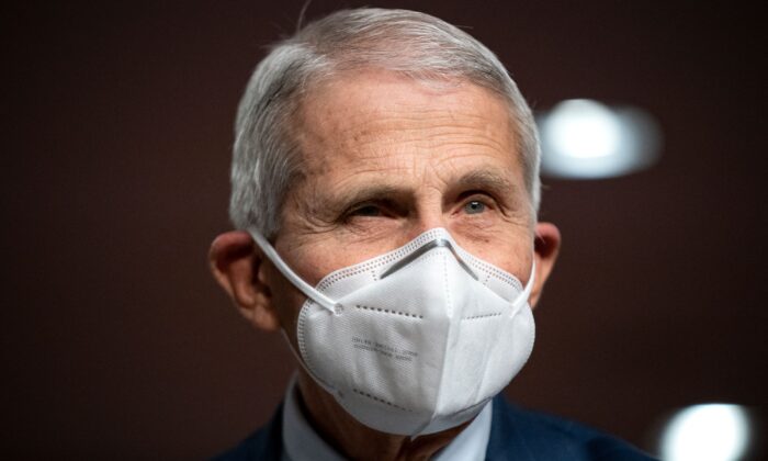 Dr. Anthony Fauci, chief medical adviser to President Joe Biden and the director of the National Institute of Alelrgy and Infectious Diseases, prepares to testify before a Senate panel in Washington on Jan. 11, 2022. (Greg Nash/Pool/AFP via Getty Images)