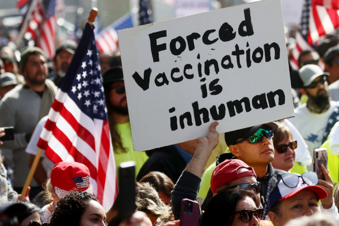 Protestors gather in Grand Park outside City Hall at a March for Freedom rally demonstrating against the Los Angeles City Council’s COVID-19 vaccine mandate for city employees and contractors, in Los Angeles, on Nov. 8, 2021. (Mario Tama/Getty Images)