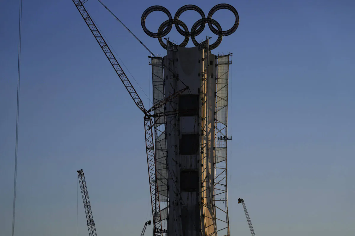 Olympic Rings assembled atop of a structure stand out near a ski resort on the outskirts of Beijing, China, Jan. 13, 2022. (AP/Ng Han Guan)