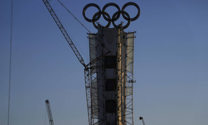 Olympic Rings assembled atop of a structure stand out near a ski resort on the outskirts of Beijing, China, Jan. 13, 2022. (AP/Ng Han Guan)