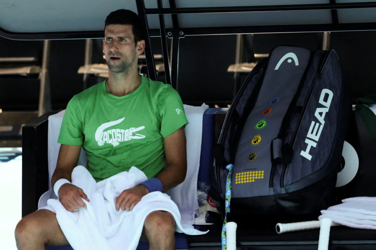 Serbian tennis player Novak Djokovic rests at Melbourne Park in Melbourne, Australia, on Jan. 13, 2022. (Loren Elliott/Reuters)