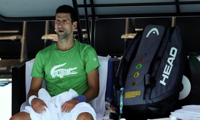 Serbian tennis player Novak Djokovic rests at Melbourne Park in Melbourne, Australia, on Jan. 13, 2022. (Loren Elliott/Reuters)