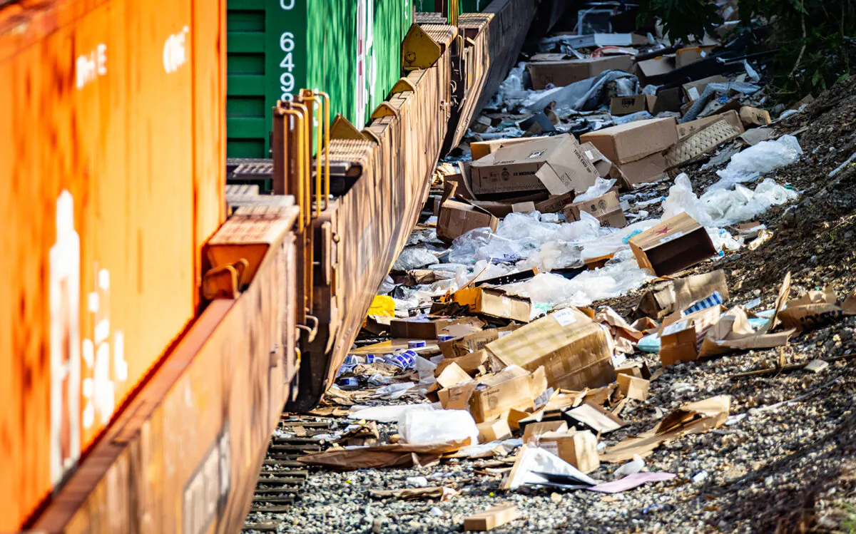 Cardboard boxes lay strewn across railroad tracks three miles from downtown Los Angeles on Jan. 14, 2022. (John Fredricks/The Epoch Times)