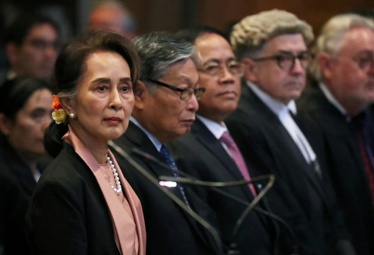 Burma's leader Aung San Suu Kyi (L) attends a hearing in a case filed by Gambia against Burma alleging genocide against the minority Muslim Rohingya population, at the International Court of Justice (ICJ) in The Hague, Netherlands, on Dec. 10, 2019. (Yves Herman/Reuters)