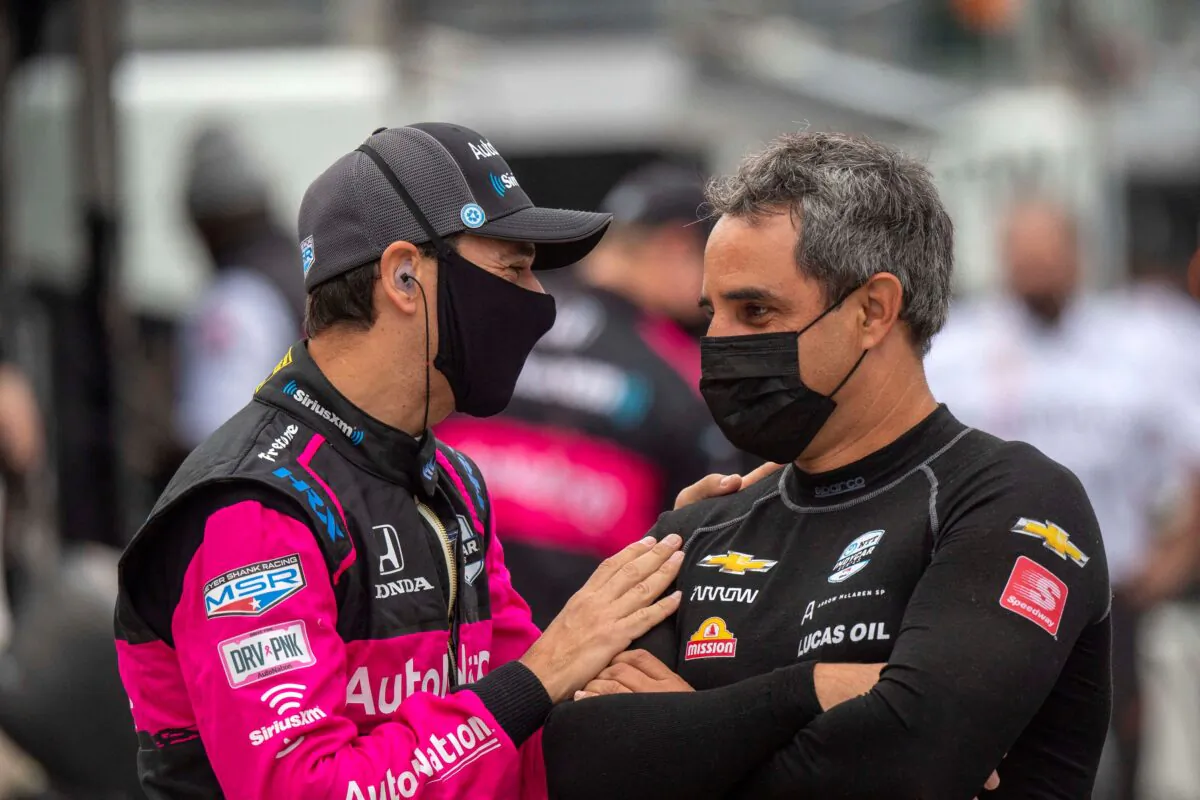 Schmidt Peterson Motorsports driver Robert Wickens (6) (L) shares a moment with Arrow McLaren SP driver and two time Indy 500 winner Juan Pablo Montoya (86) before practice begins at Indianapolis Motor Speedway in Indianapolis, on May 18, 2021. (Marc Lebryk/USA TODAY Sports via Reuters)