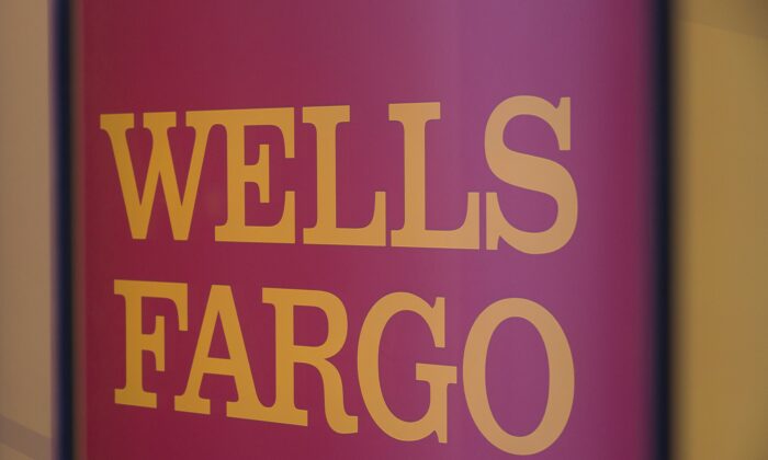 The Wells Fargo logo is seen inside a branch in Washington, on July 9, 2019. (Alastair Pike/AFP via Getty Images)