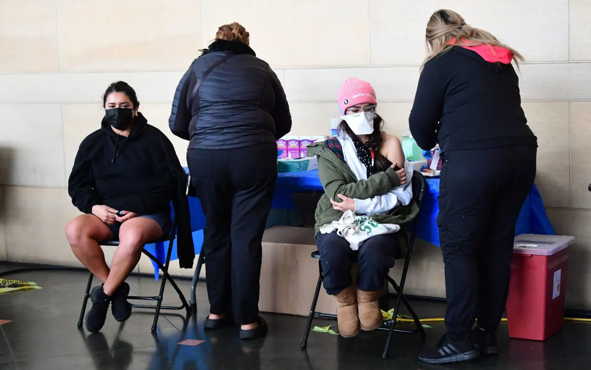 People receive a COVID-19 vaccination at Union Station in Los Angeles on Jan. 7, 2022. (Frederic J. Brown/AFP via Getty Images)