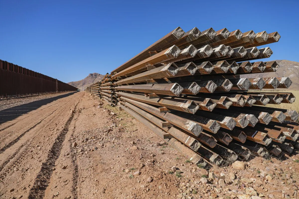 Border wall panels sit untouched since January 2021 when President Joe Biden halted all border wall construction, in Cochise County, Arizona on Dec. 6, 2021. (Charlotte Cuthbertson/The Epoch Times)
